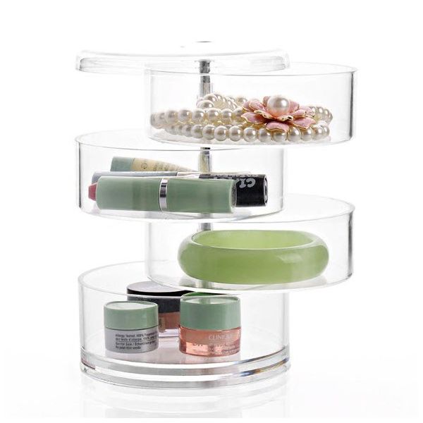 Runder Aufbewahrungsturm aus transparentem Kunststoff schafft im Nu Ordnung auf dem Make-Up Tisch oder im Schafzimmer. 